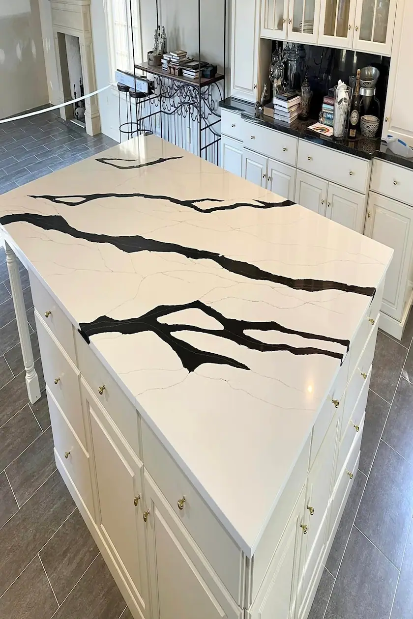 Kitchen island with a bold black-veined white quartz countertop